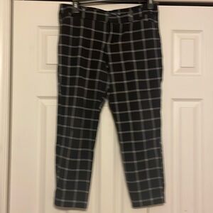 Old Navy black pixie pants with white stripes.